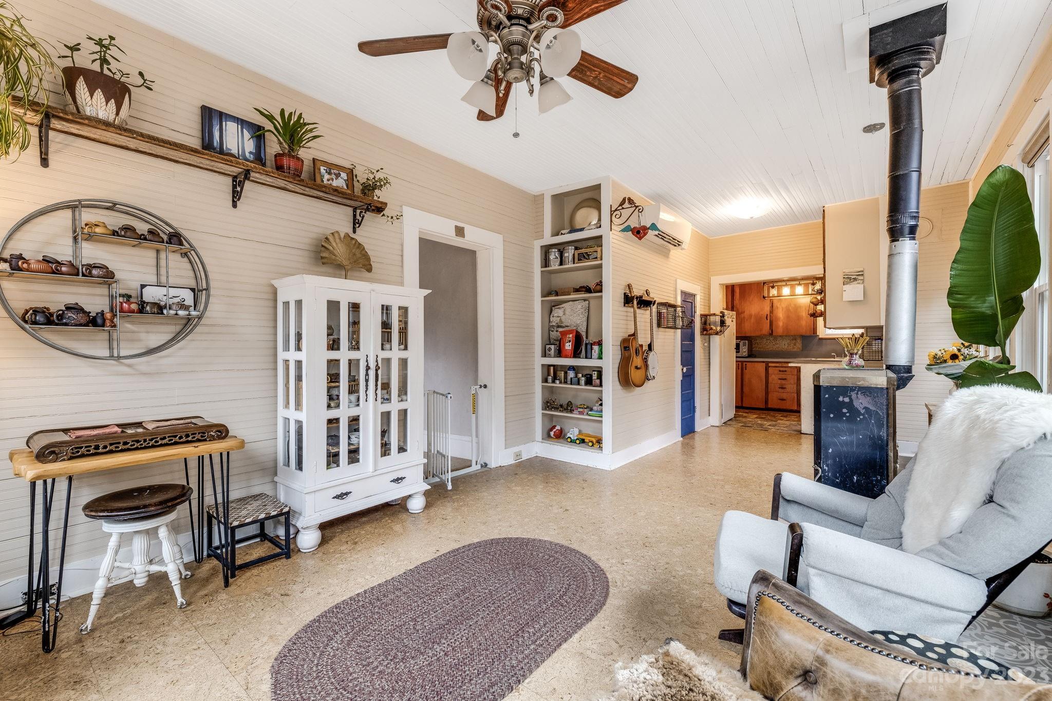 2412 Stackhouse Road Marshall, NC 28753 - Photo 22 of 48 a living room with furniture and a flat screen tv