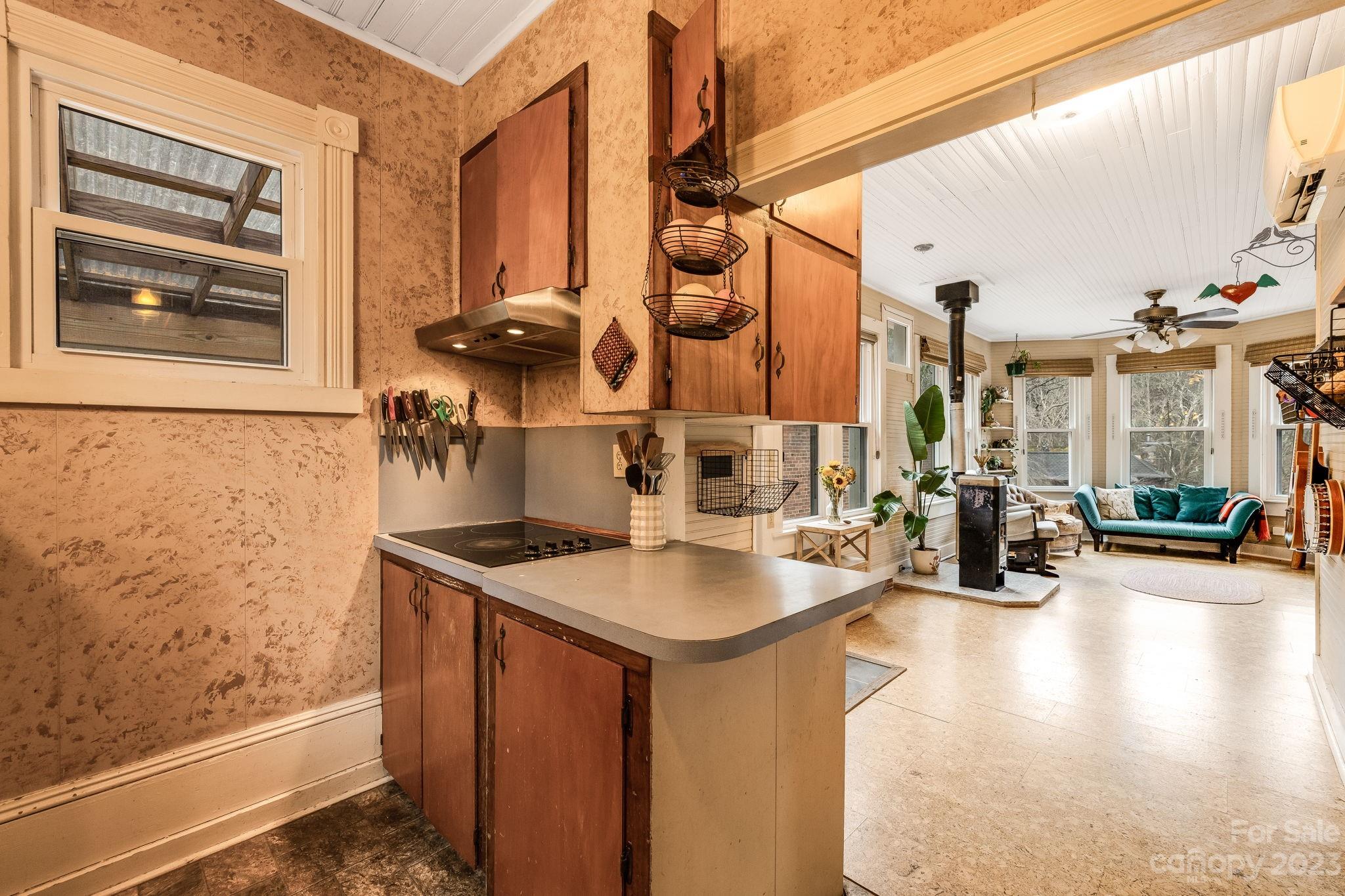 2412 Stackhouse Road Marshall, NC 28753 - Photo 25 of 48 a kitchen with stainless steel appliances granite countertop a sink and a wooden cabinets