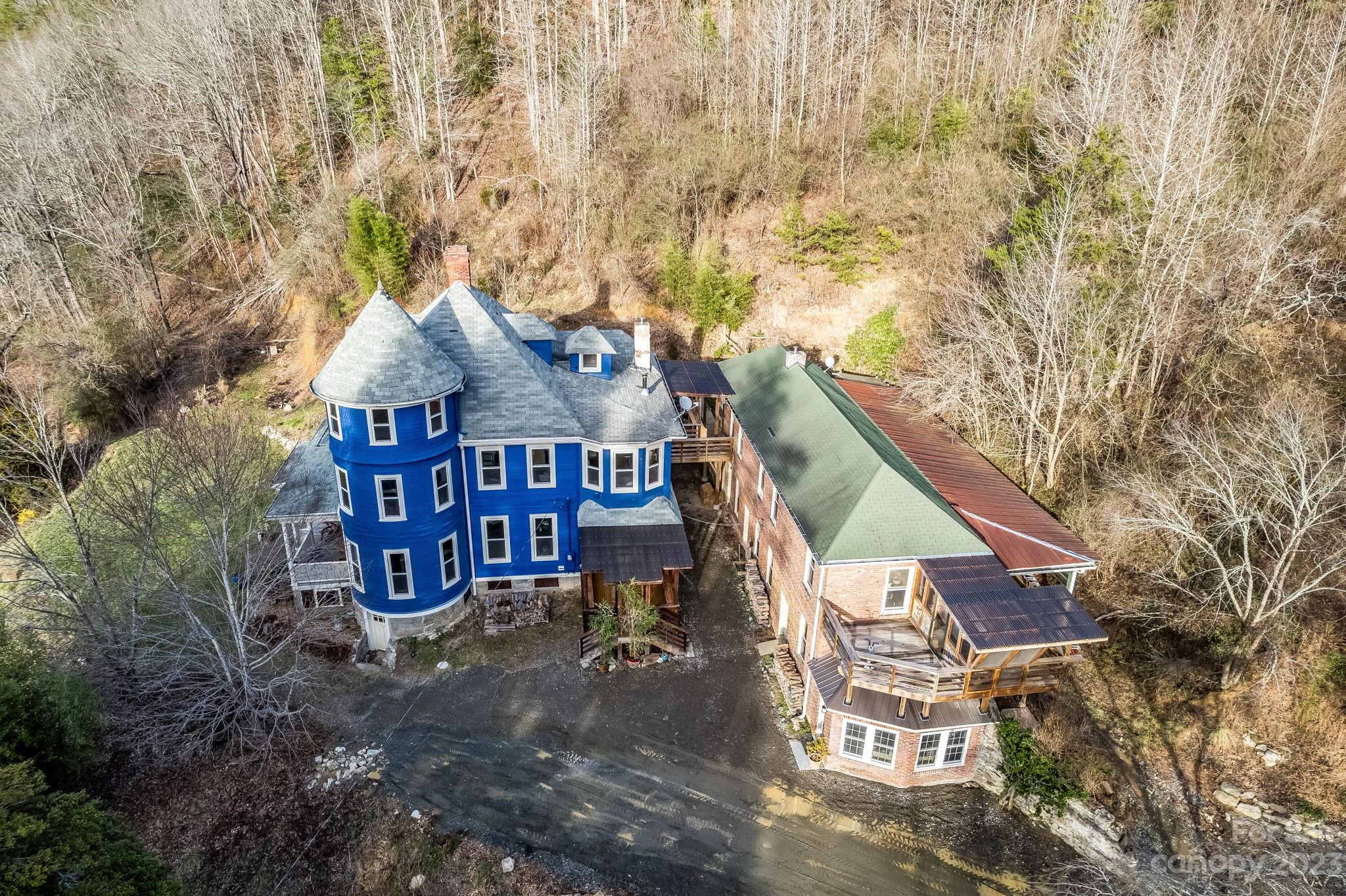2412 Stackhouse Road Marshall, NC 28753 - Photo 3 of 48 a view of a house with a yard and wooden fence