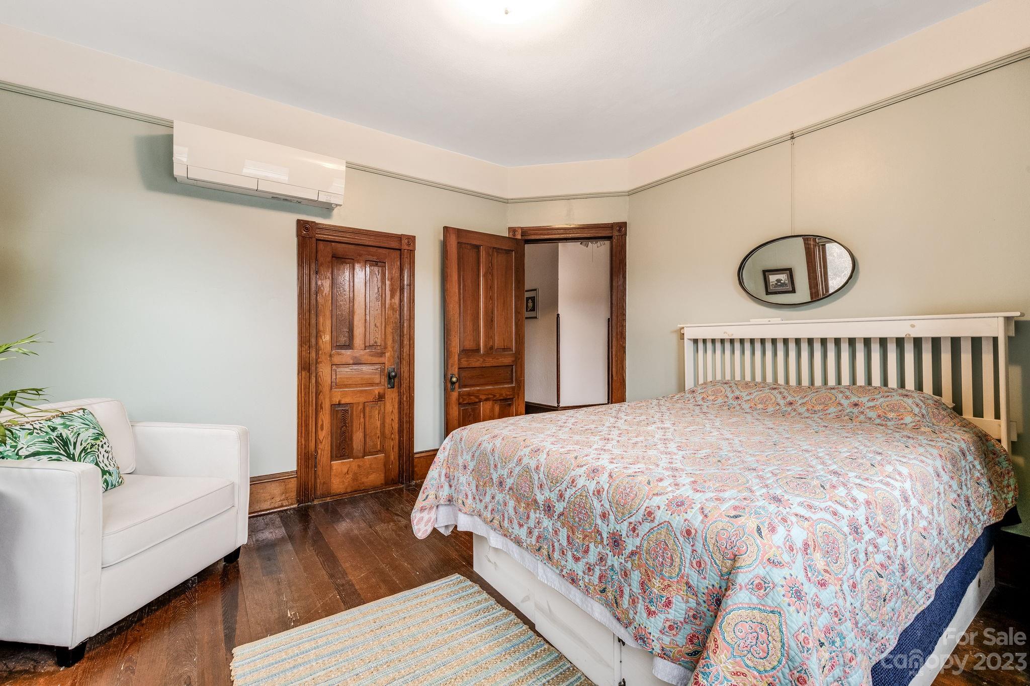 2412 Stackhouse Road Marshall, NC 28753 - Photo 31 of 48 a spacious bedroom with a bed and a couch