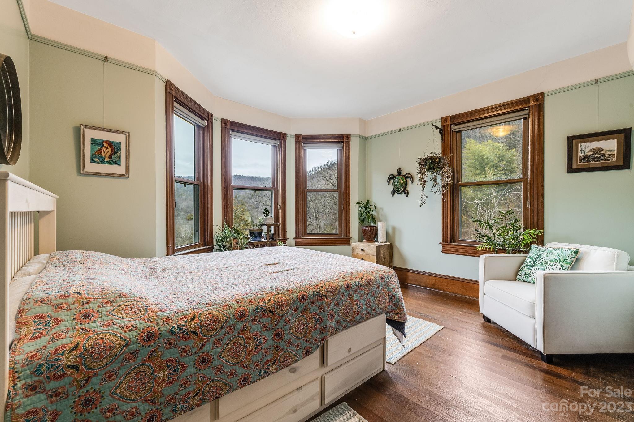 2412 Stackhouse Road Marshall, NC 28753 - Photo 32 of 48 a bedroom with a large bed couch and a window