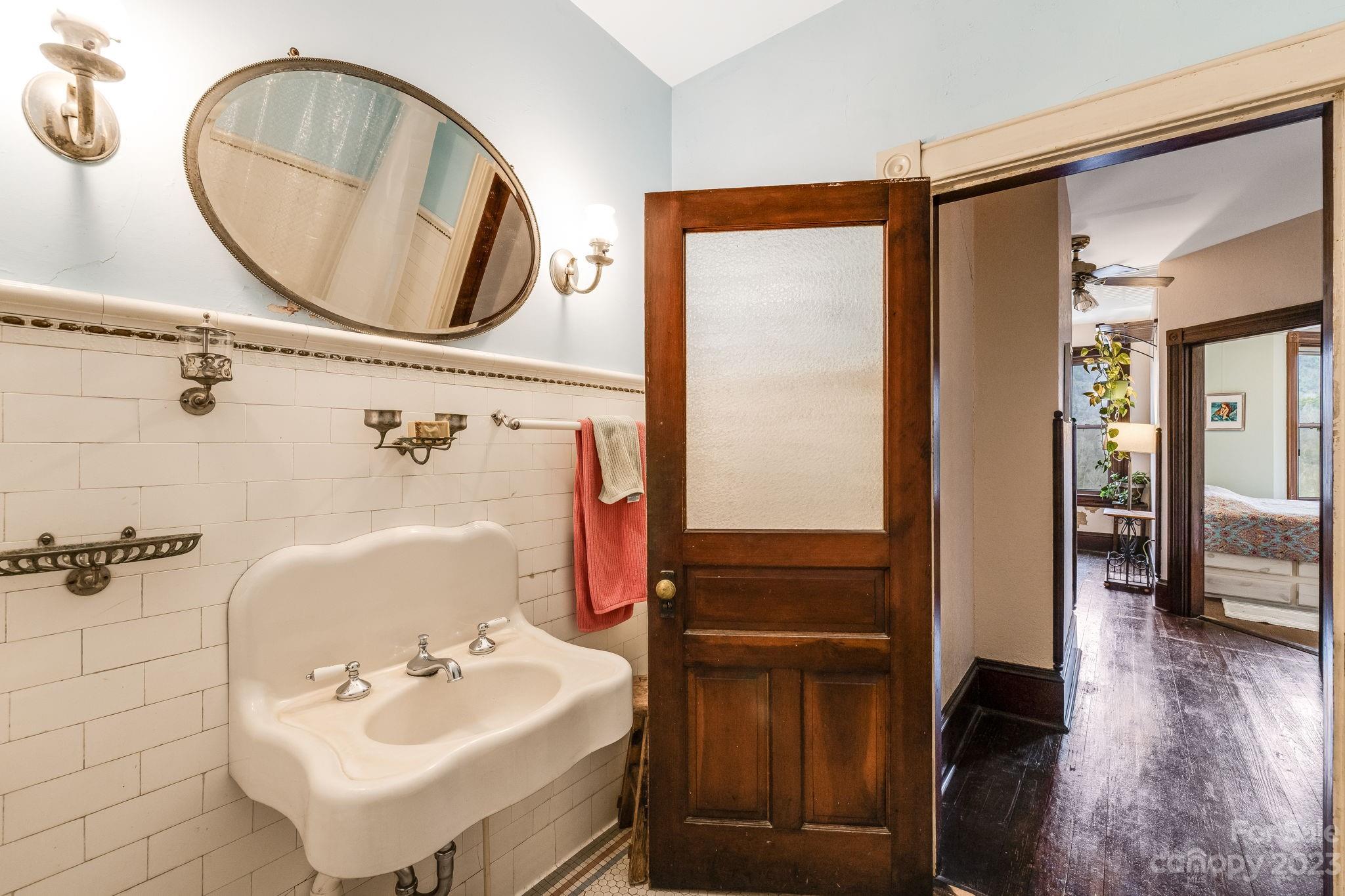 2412 Stackhouse Road Marshall, NC 28753 - Photo 33 of 48 a bathroom with a sink and a mirror