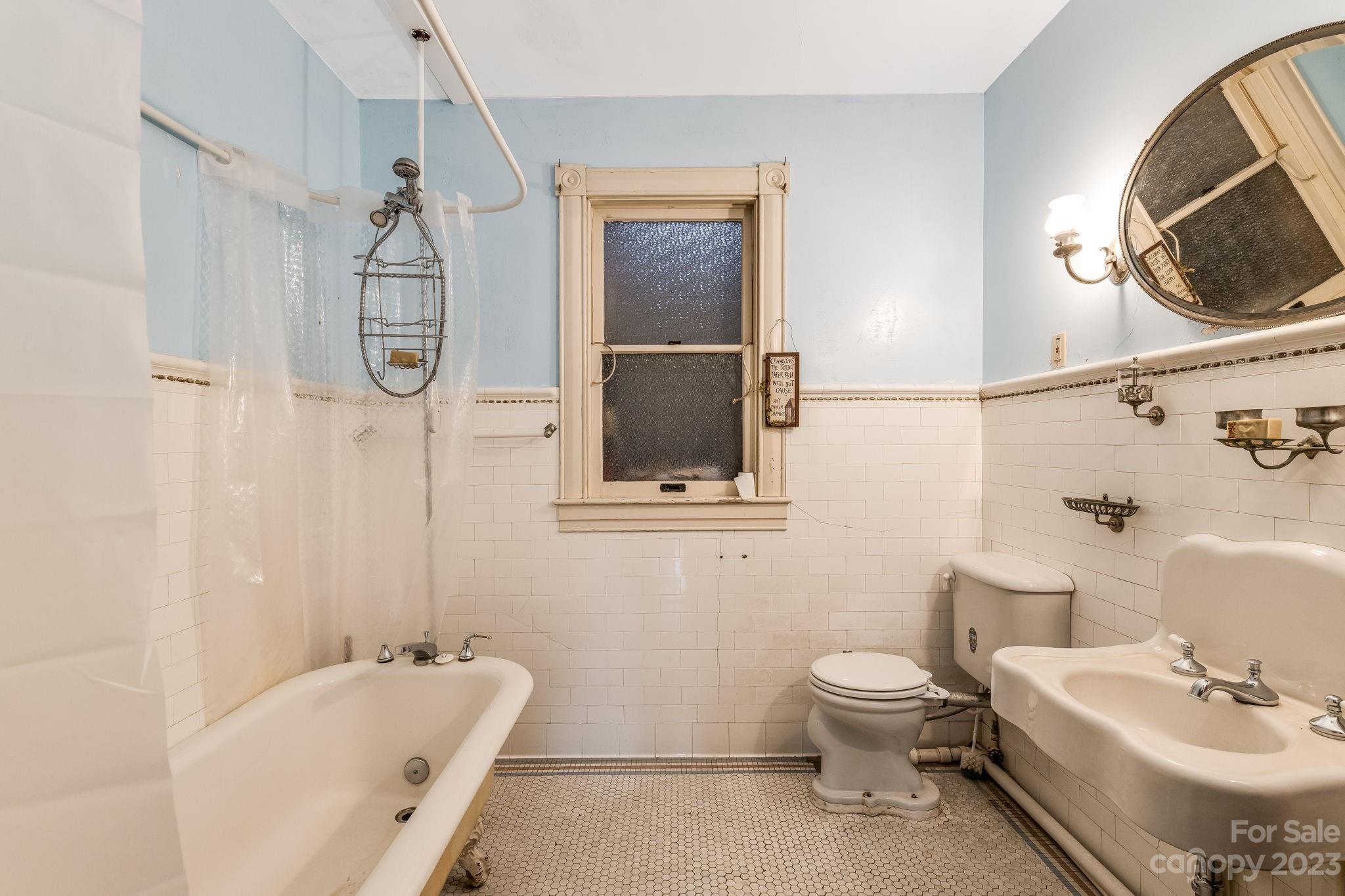 2412 Stackhouse Road Marshall, NC 28753 - Photo 34 of 48 a bathroom with a sink toilet and shower