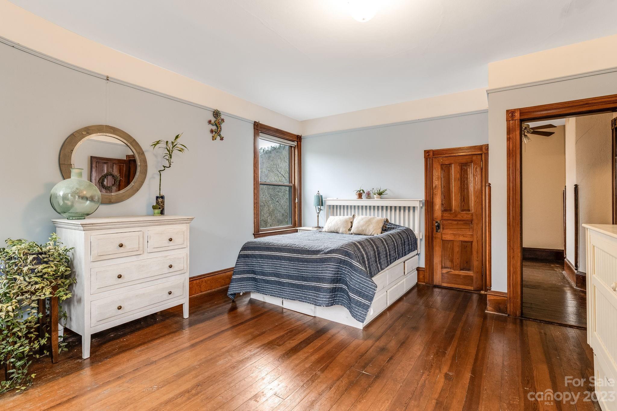 2412 Stackhouse Road Marshall, NC 28753 - Photo 35 of 48 a bedroom with a bed and a dresser