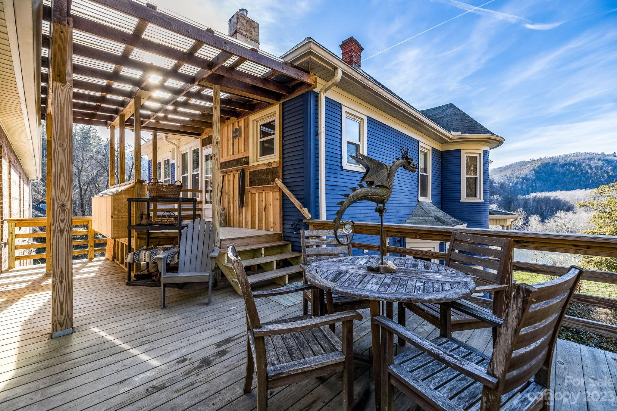 2412 Stackhouse Road Marshall, NC 28753 - Photo 40 of 48 a view of a chairs and table on the deck