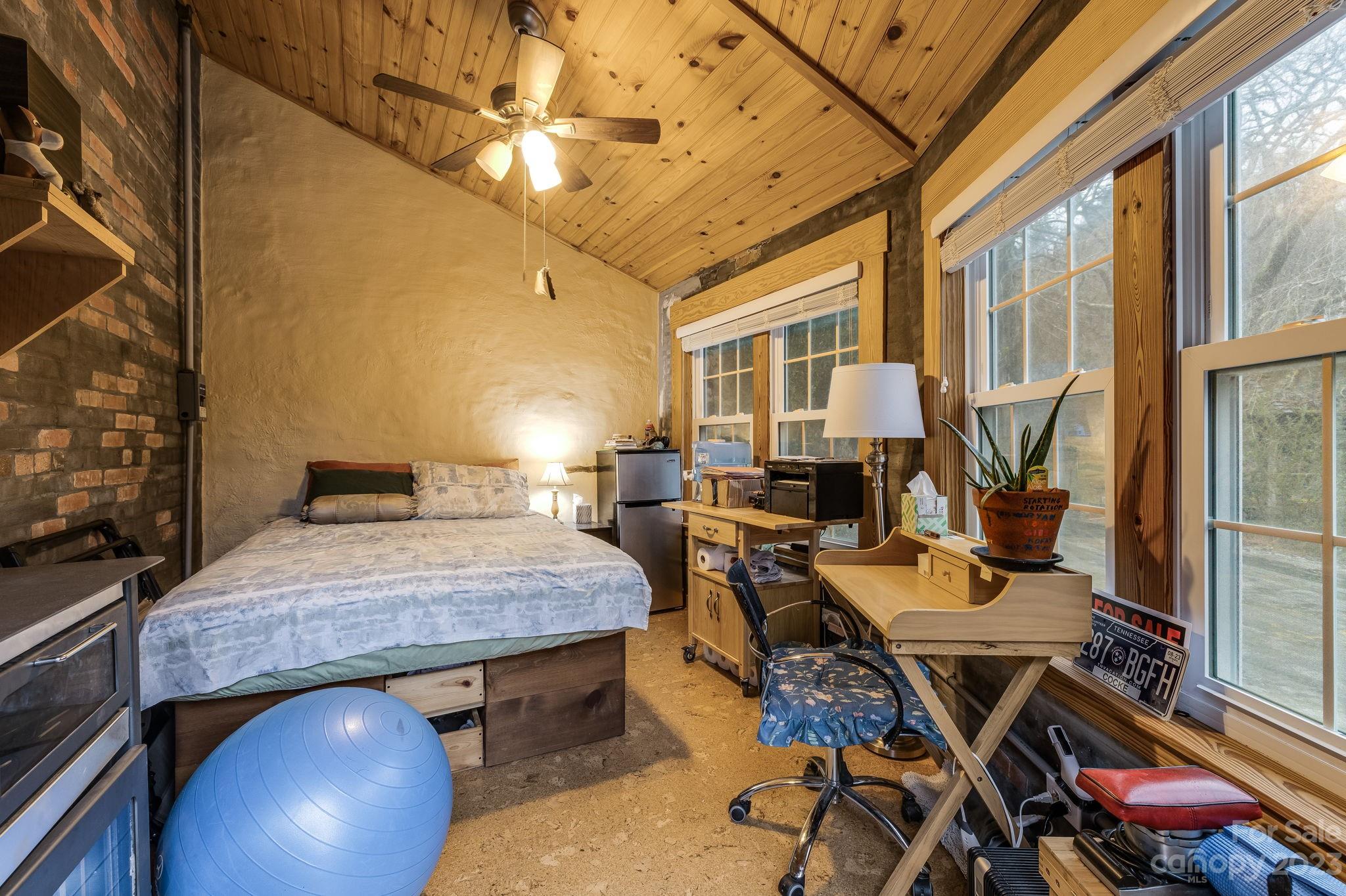 2412 Stackhouse Road Marshall, NC 28753 - Photo 44 of 48 a view of a dining room with furniture window and wooden floor