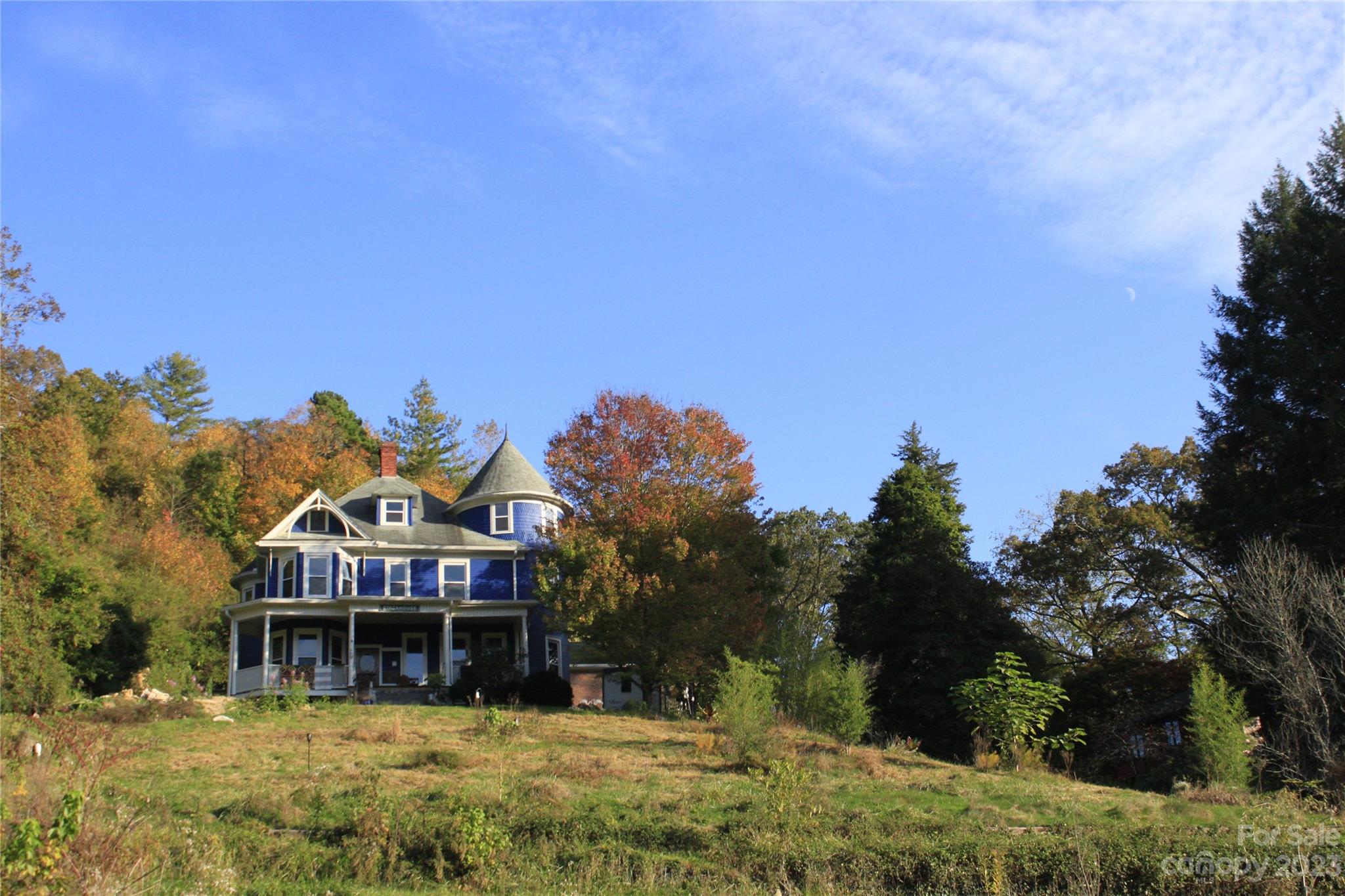 2412 Stackhouse Road Marshall, NC 28753 - Photo 6 of 48 a view of a house with a yard and sitting area