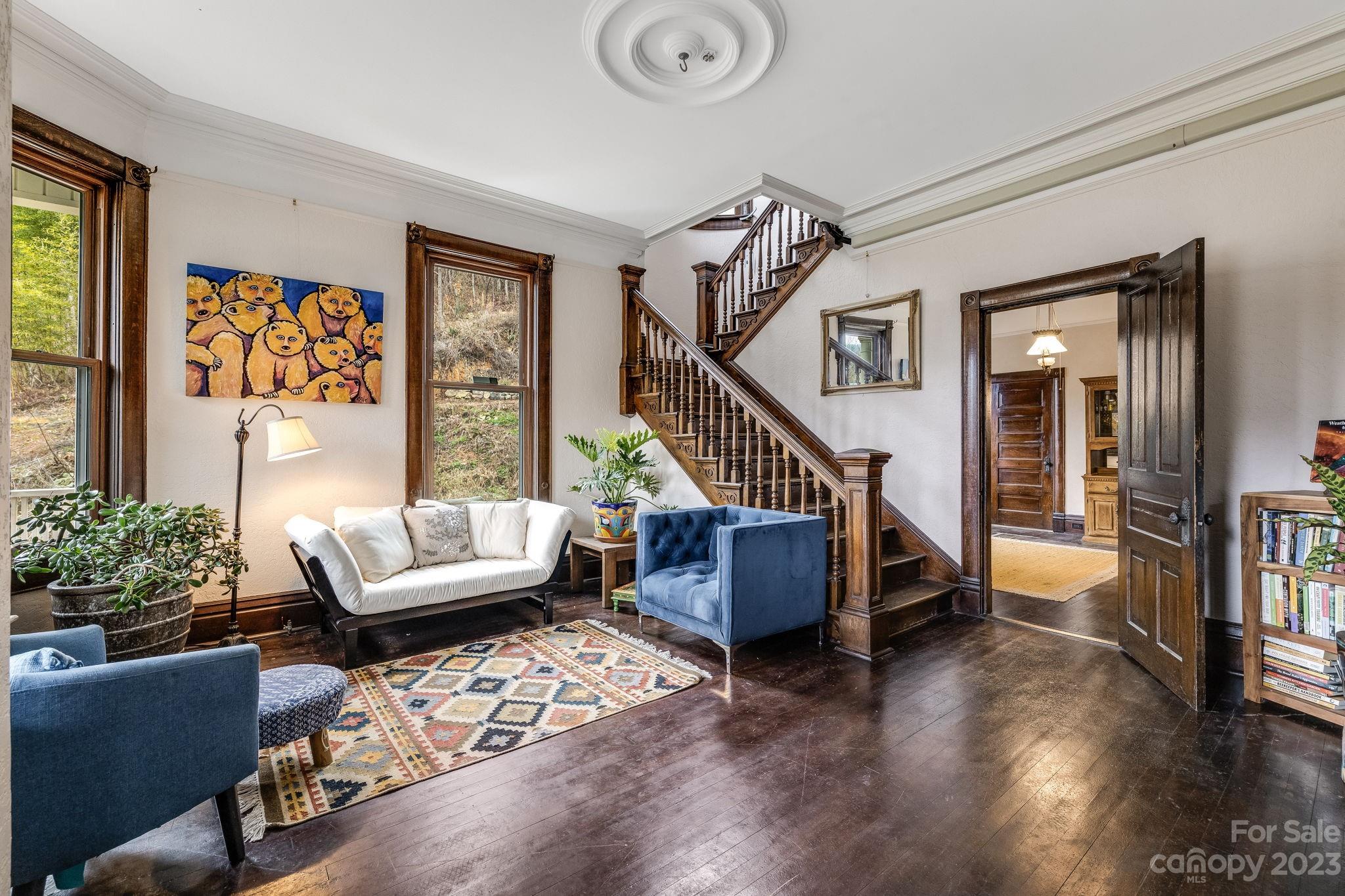 2412 Stackhouse Road Marshall, NC 28753 - Photo 10 of 48 a living room with furniture and a painting on the wall