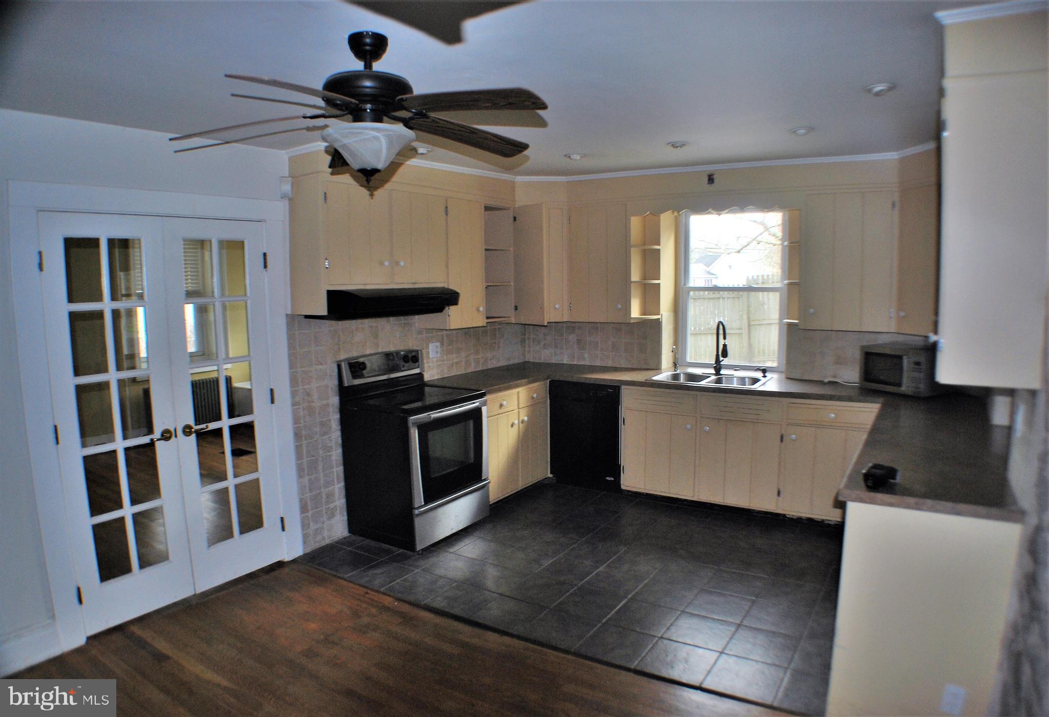 3199 Main Street Green Lane, PA 18054 - Photo 7 of 21 Kitchen with French doors to living room
