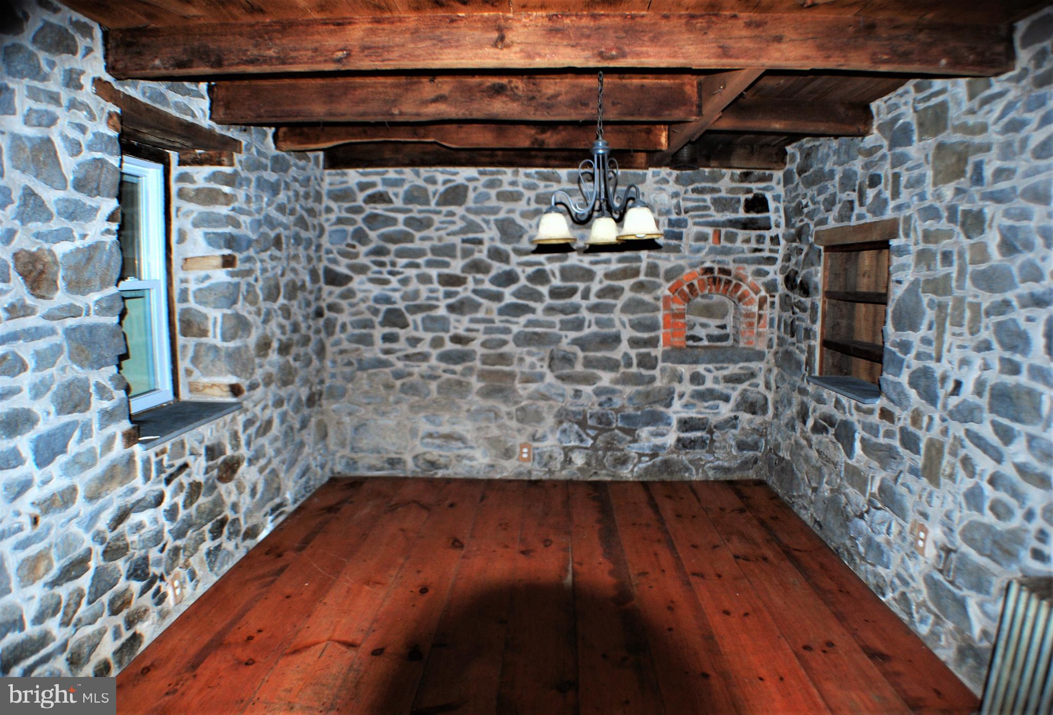 3199 Main Street Green Lane, PA 18054 - Photo 10 of 21 Dining room with exposed stone walls