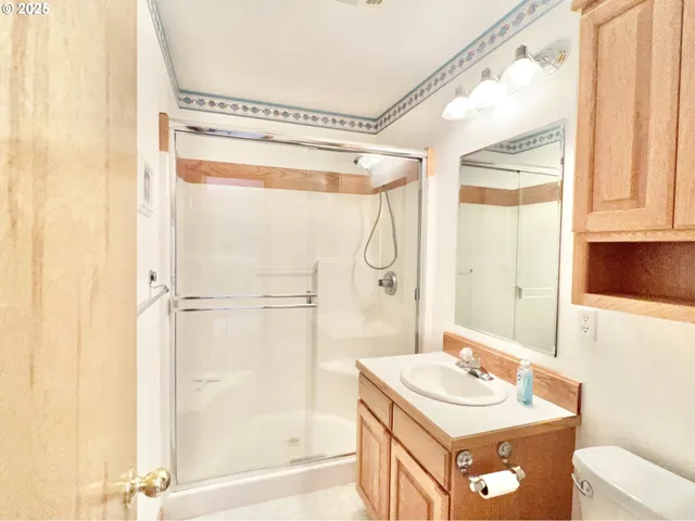 a bathroom with a sink a mirror and a shower