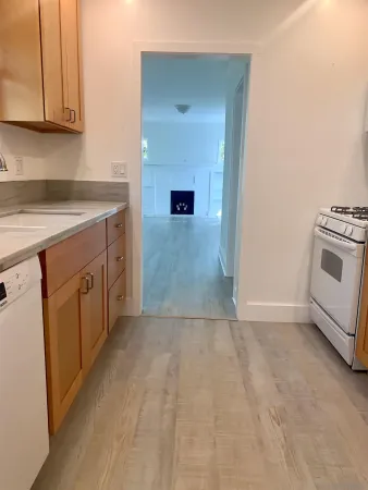 a view of a kitchen with cabinets