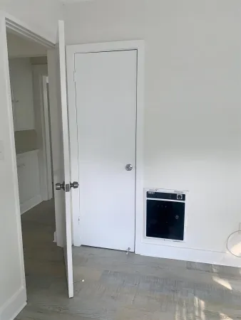 a view of an empty room and fire place