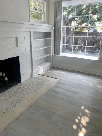 a view of an empty room with a window