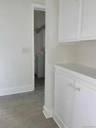a view of storage and utility room with closet