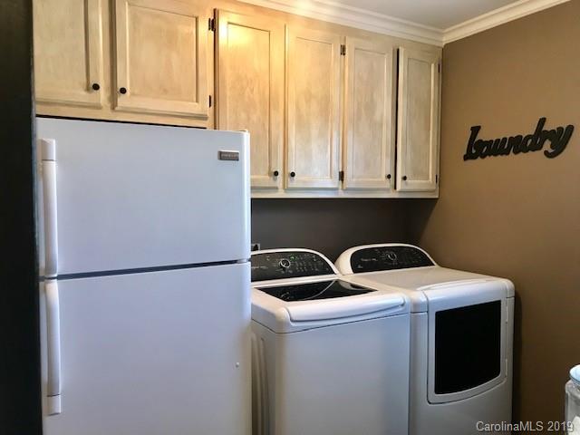 2802 Reece Drive Monroe, NC 28110 - Photo 15 of 37 a kitchen with a refrigerator and cabinets