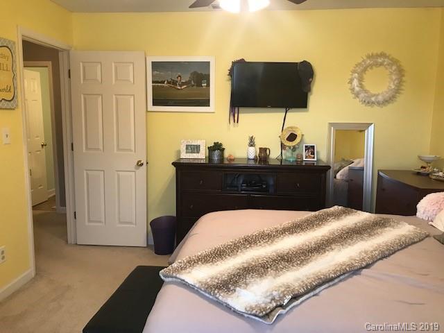 2802 Reece Drive Monroe, NC 28110 - Photo 20 of 37 a bedroom with a bed and flat screen tv