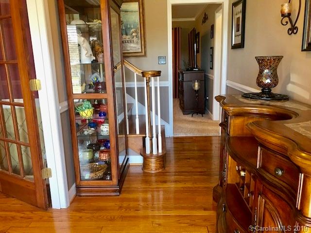 2802 Reece Drive Monroe, NC 28110 - Photo 3 of 37 a view of a hallway with wooden floor and windows
