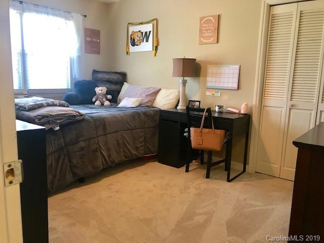 2802 Reece Drive Monroe, NC 28110 - Photo 21 of 37 a bedroom with a bed and a table in it