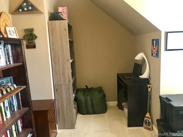 2802 Reece Drive Monroe, NC 28110 - Photo 24 of 37 a room with furniture and a book shelf