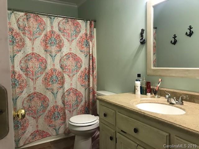 2802 Reece Drive Monroe, NC 28110 - Photo 26 of 37 a bathroom with a granite countertop toilet sink and mirror