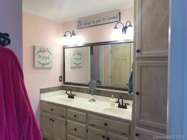 2802 Reece Drive Monroe, NC 28110 - Photo 29 of 37 a bathroom with a sink and a mirror
