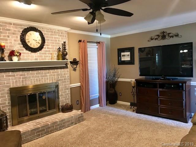 2802 Reece Drive Monroe, NC 28110 - Photo 7 of 37 a living room with furniture and a flat screen tv