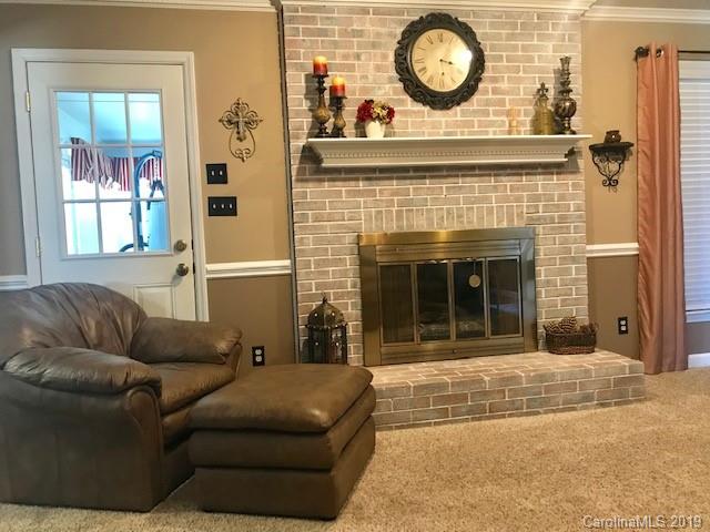 2802 Reece Drive Monroe, NC 28110 - Photo 8 of 37 a living room with furniture and a fireplace