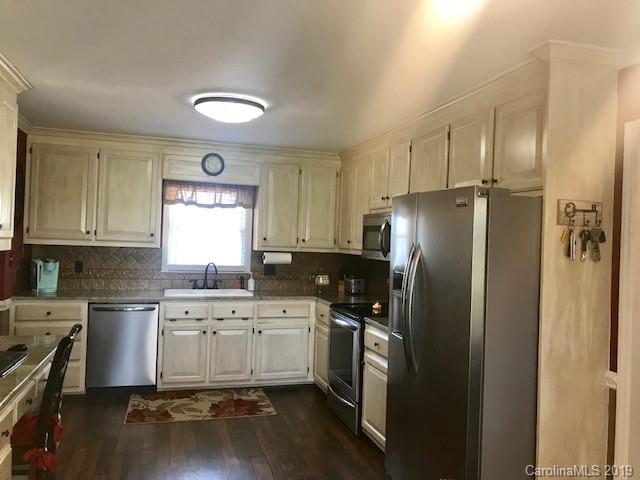 2802 Reece Drive Monroe, NC 28110 - Photo 10 of 37 a kitchen with a sink stainless steel appliances and cabinets