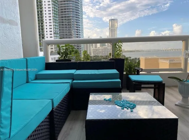a view of a chairs and table in the patio
