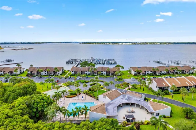 an aerial view of a houses with a lake view