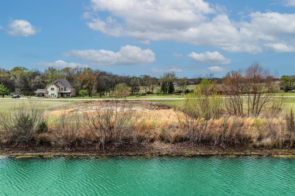 119 Dolly Road Sulphur Springs, TX 75482 - Photo 2 of 8 a view of a lake with houses in the back