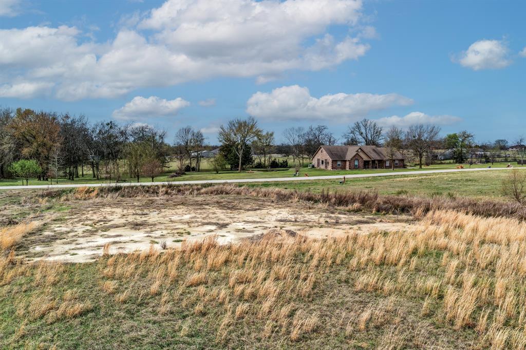119 Dolly Road Sulphur Springs, TX 75482 - Photo 5 of 8 a view of a golf course with a lake
