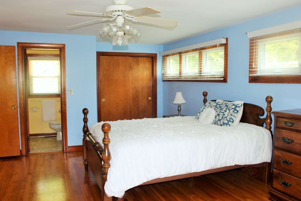 15 Alpine Road Norwood, MA 02062 - Photo 12 of 18 a bedroom with a bed and wooden floor