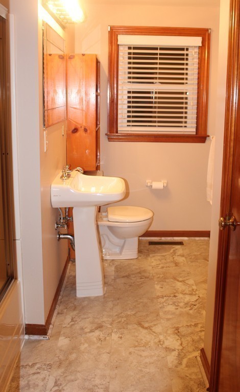 15 Alpine Road Norwood, MA 02062 - Photo 13 of 18 a bathroom with a sink a toilet and shower