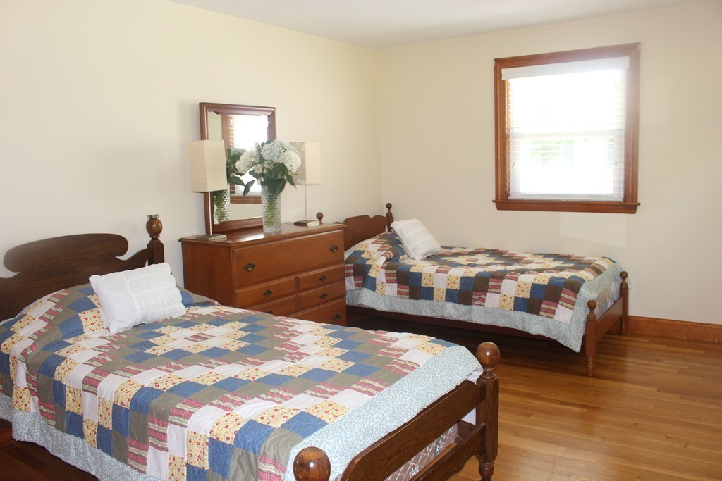 15 Alpine Road Norwood, MA 02062 - Photo 16 of 18 a bedroom with a bed and wooden floor