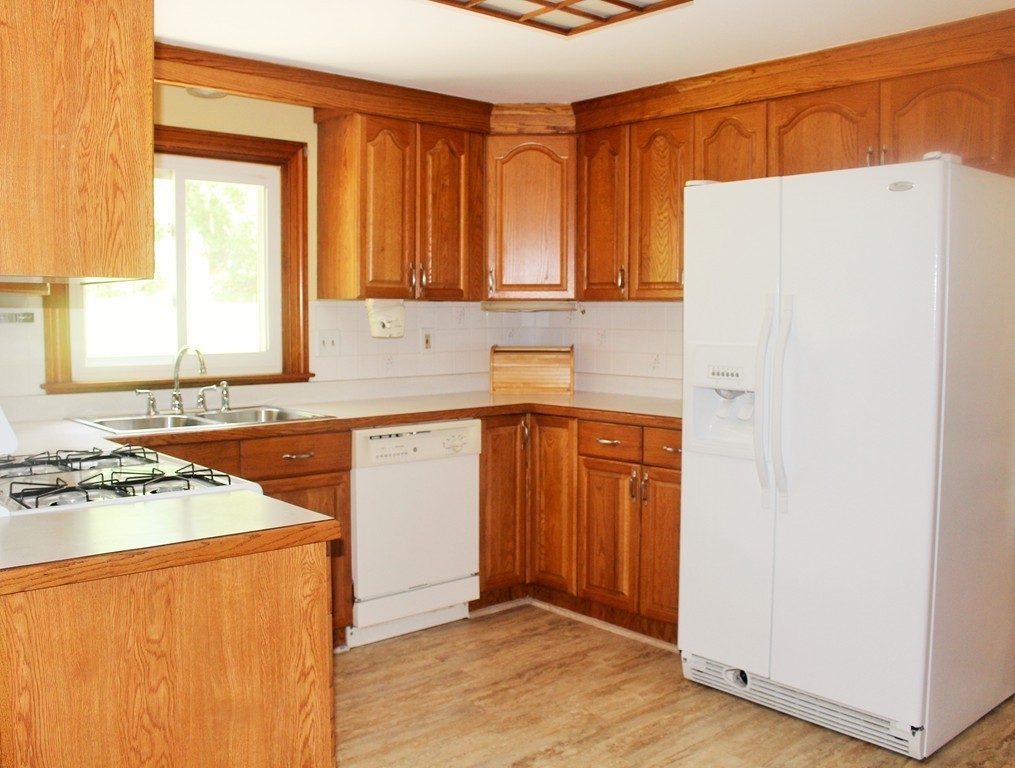 15 Alpine Road Norwood, MA 02062 - Photo 7 of 18 a kitchen with stainless steel appliances a refrigerator sink and cabinets