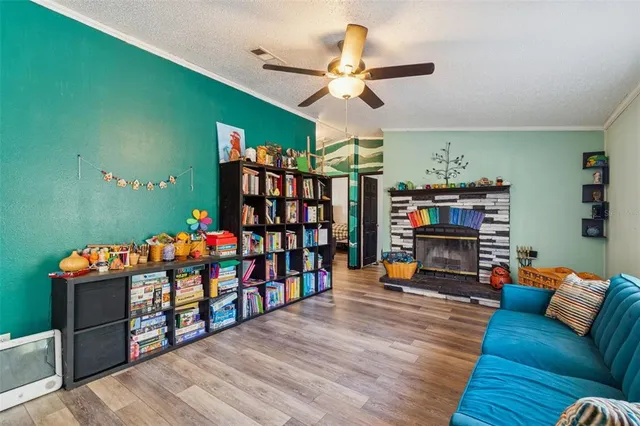 a living room with lots of furniture and a wooden floor