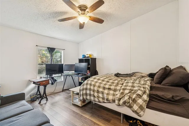 a bedroom with bed and a window