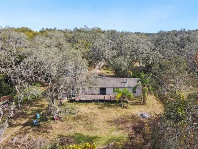 an aerial view of residential house with outdoor space