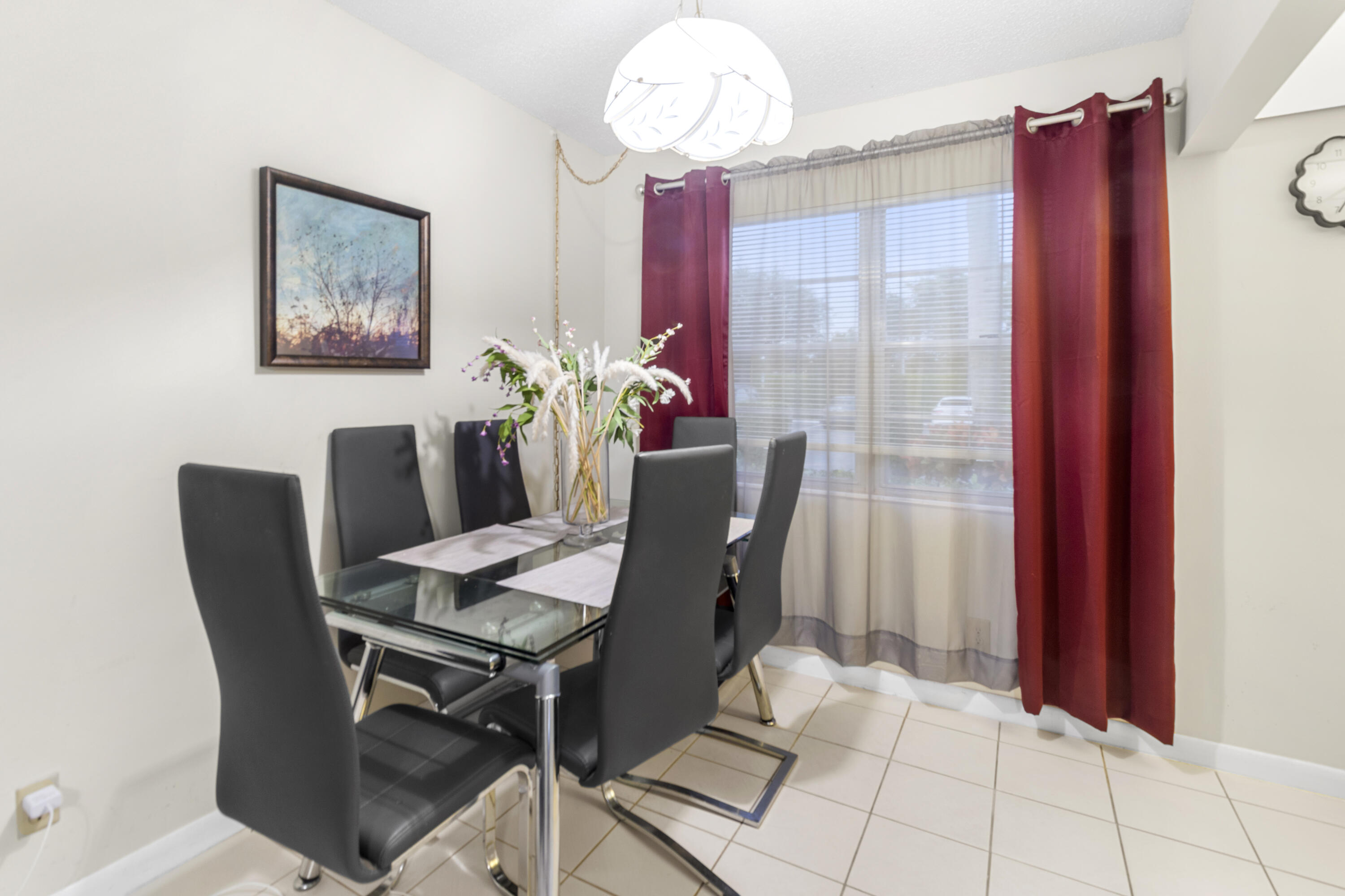 505 Mansfield M Boca Raton, FL 33434 - Photo 2 of 7 a dining room with furniture and chandelier