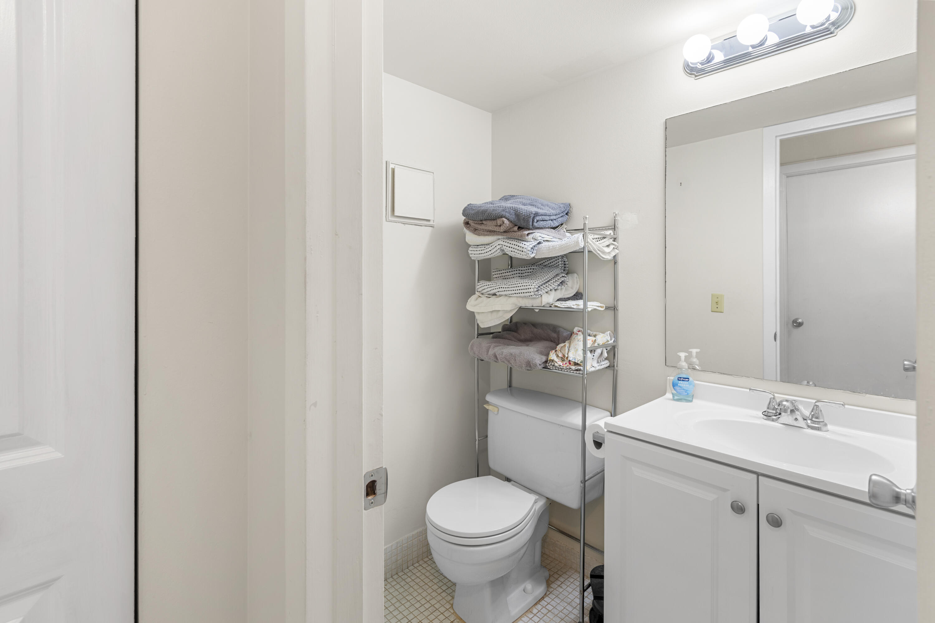 505 Mansfield M Boca Raton, FL 33434 - Photo 6 of 7 a bathroom with a sink toilet and vanity