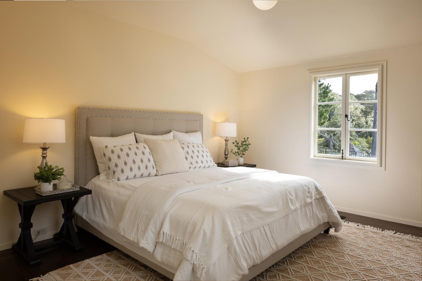 3269 Cabrillo Road Pebble Beach, CA 93953 - Photo 23 of 44 a bedroom with a bed and window