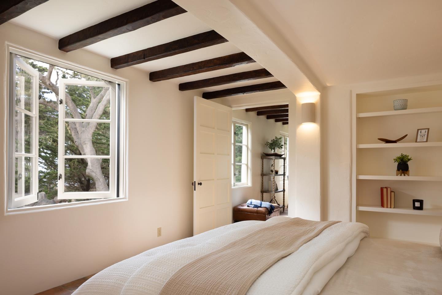 3269 Cabrillo Road Pebble Beach, CA 93953 - Photo 32 of 44 a bedroom with a bed and a window