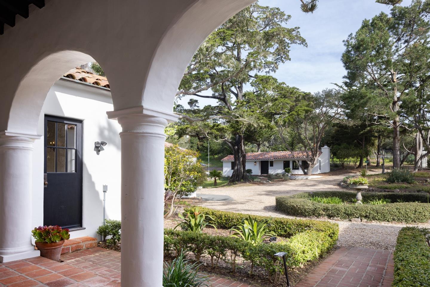 3269 Cabrillo Road Pebble Beach, CA 93953 - Photo 36 of 44 a front view of a house with garden