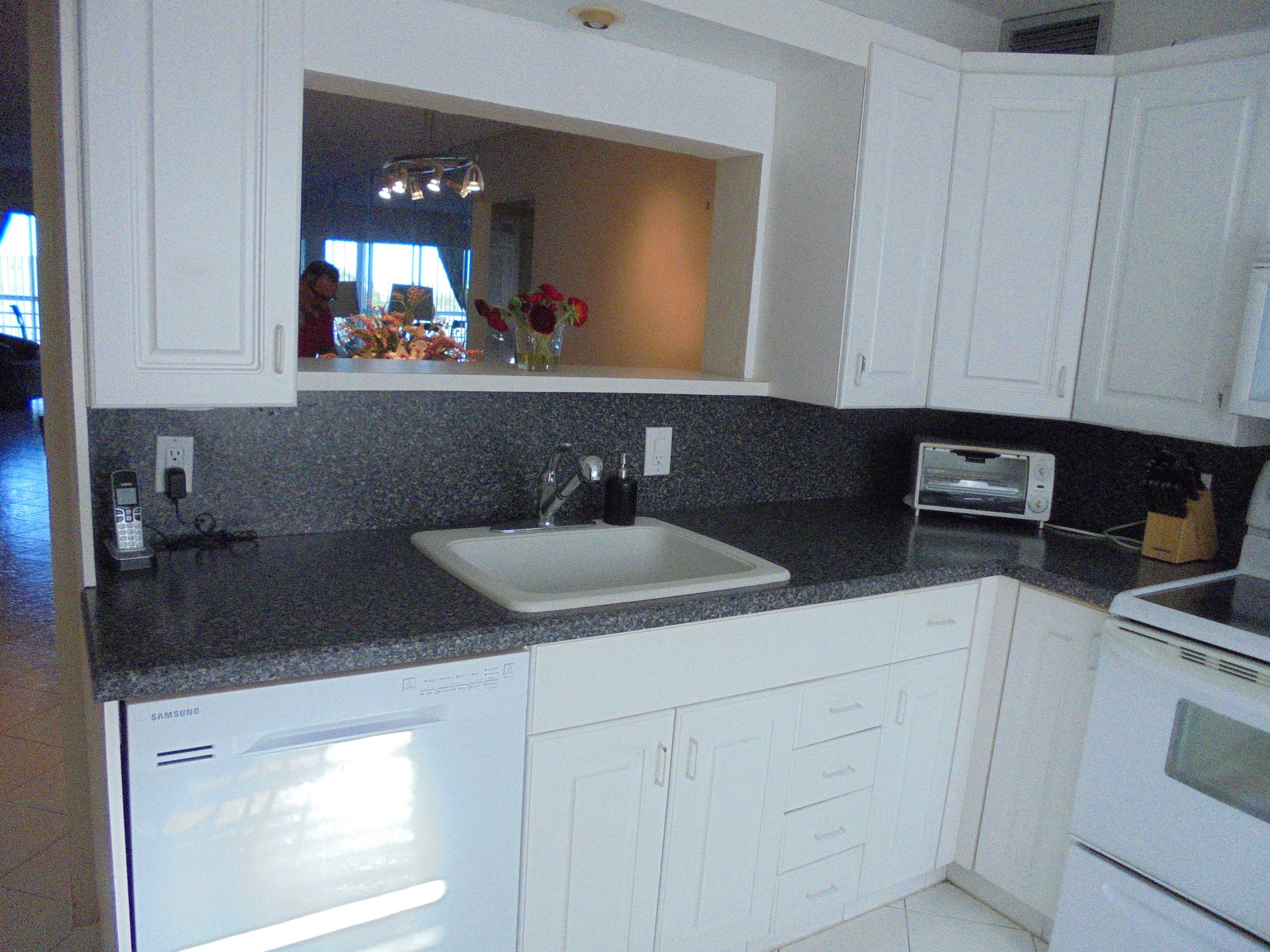 4037 Exeter C Boca Raton, FL 33434 - Photo 5 of 15 a kitchen with a sink and cabinets