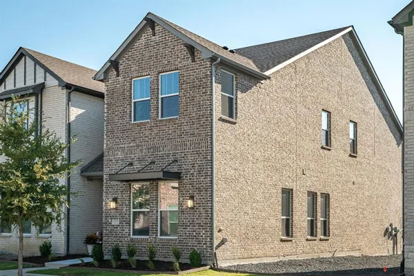 a brick house with windows on it
