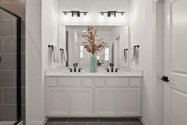a bathroom with mirror and sink