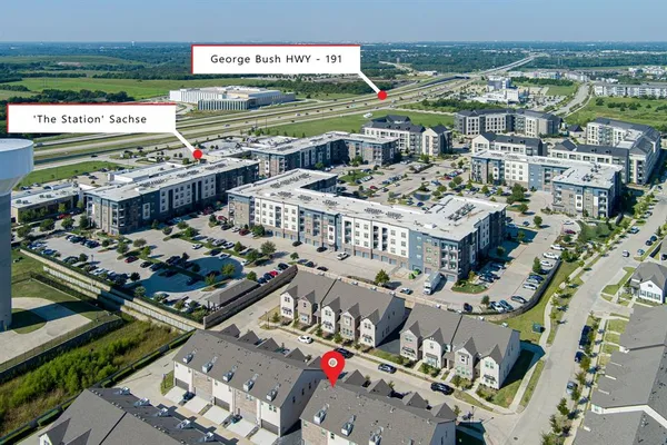 an aerial view of a house with outdoor space