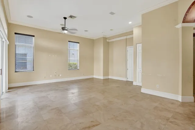 a view of an empty room and a window